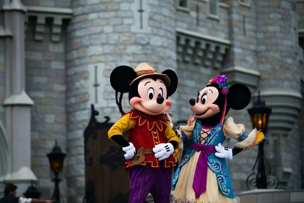 mickey mouse and minnie mouse in costume