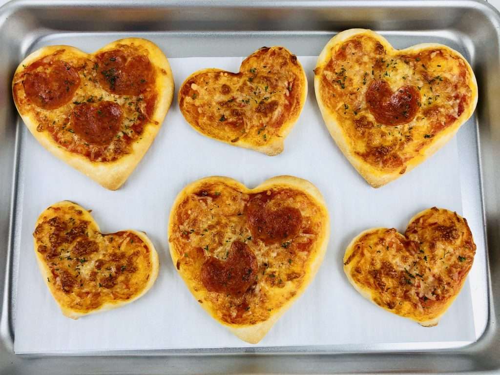 heart shaped mini pizza with cheese and pepperoni 