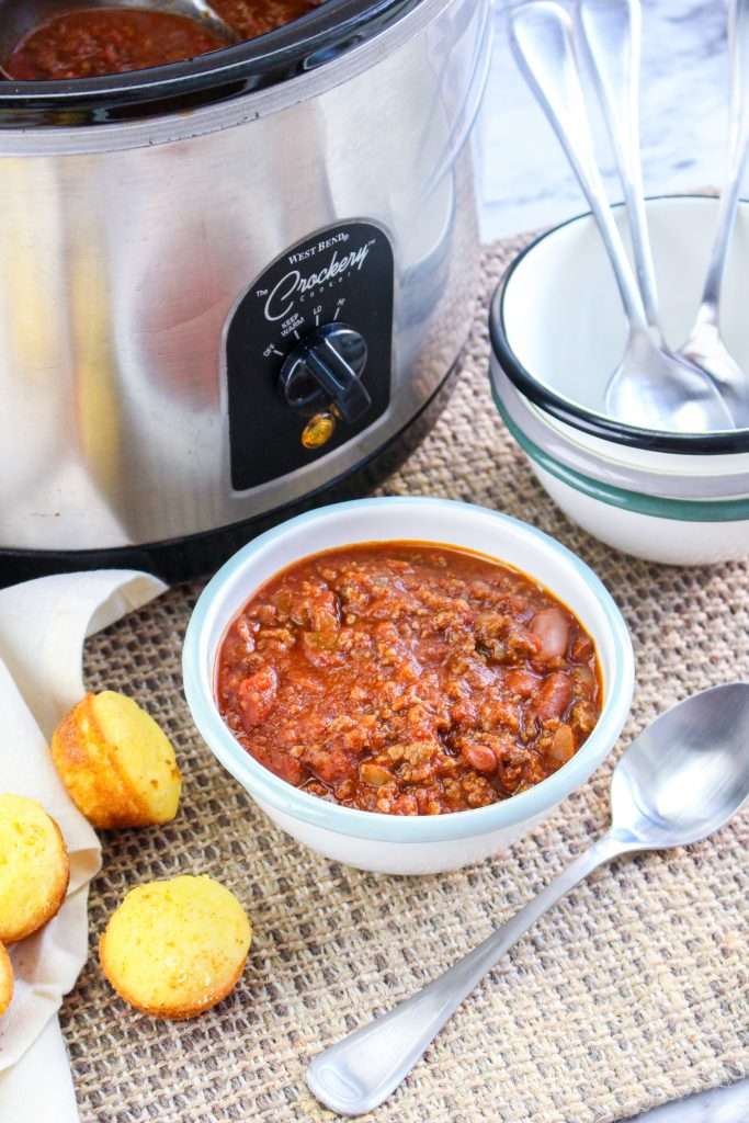 Venison Chili 7 crockpot deer chili in a white bowl with cornbread