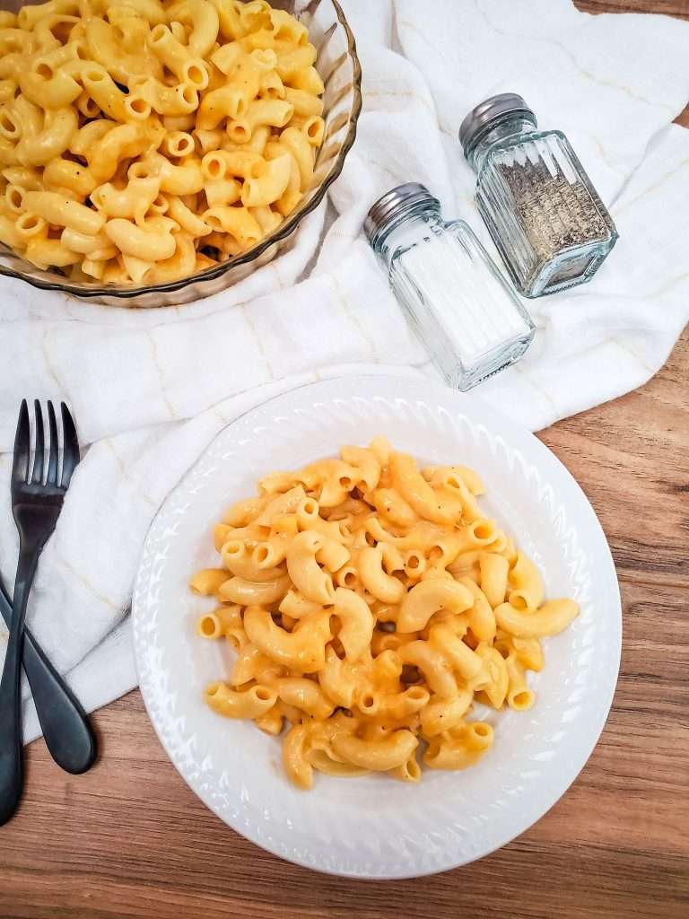 Crockpot Mac and Cheese 11 crockpot macaroni and cheese in a white bowl with salt and pepper