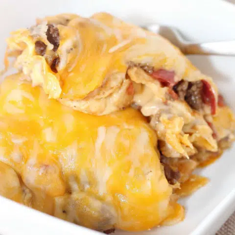 Taco Casserole Recipe With Tortillas 8 Cheesy Taco Casserole on white plate
