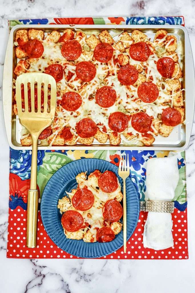 How To Make Pizza Tots With Pepperoni & Mozzarella 10 pizza tots on a sheet pan and a blue plate