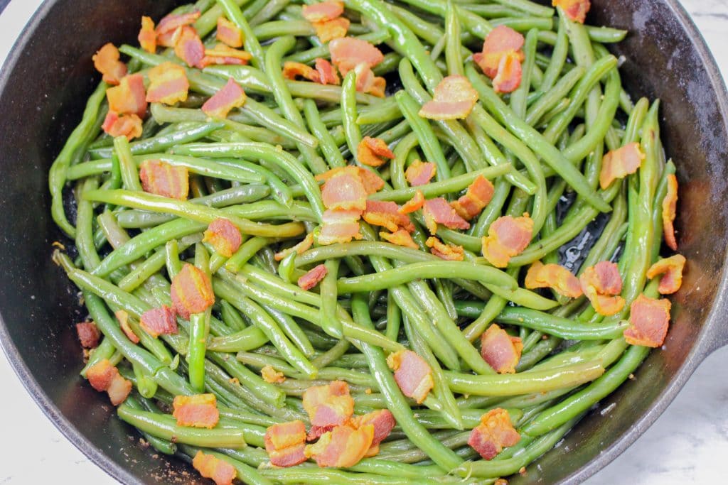 The Best Bacon Green Beans Recipe 8 fresh green beans with bacon in a pan
