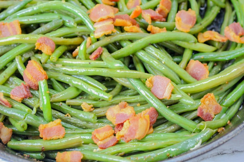 The Best Bacon Green Beans Recipe 2 close up of fresh green beans with bacon in a pan