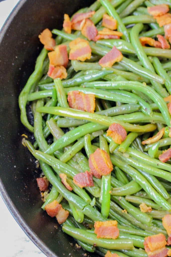 The Best Bacon Green Beans Recipe 10 close up of fresh green beans with bacon in a pan