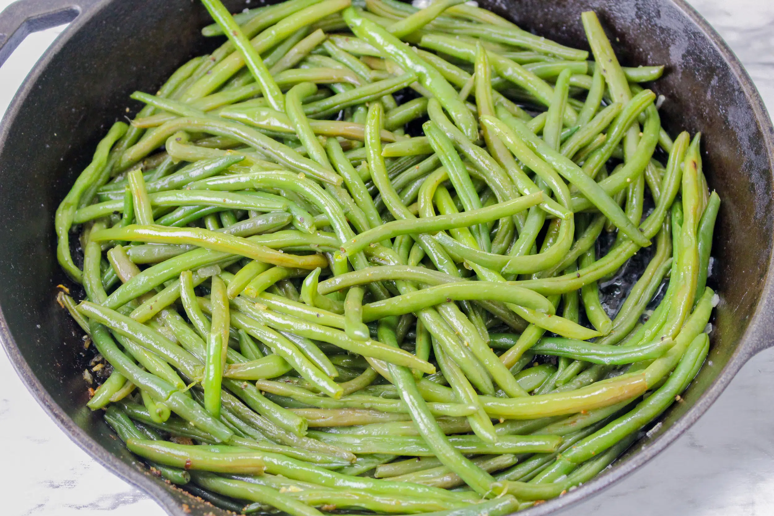 fresh green beans in a pan