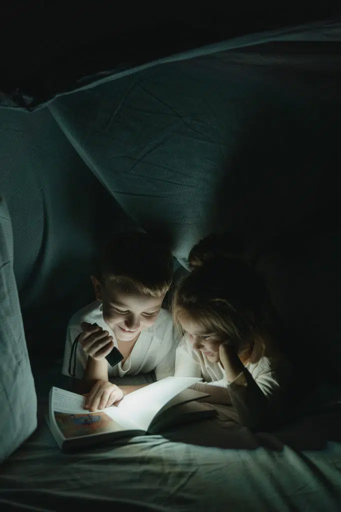 Kids reading in bed