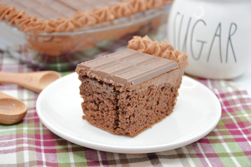 Hershey's Chocolate Cake a slice of Hershey's chocolate cake on white plate