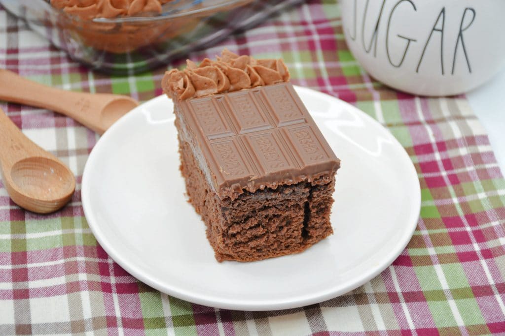 Hershey's Chocolate Cake a slice of Hershey's chocolate cake on white plate