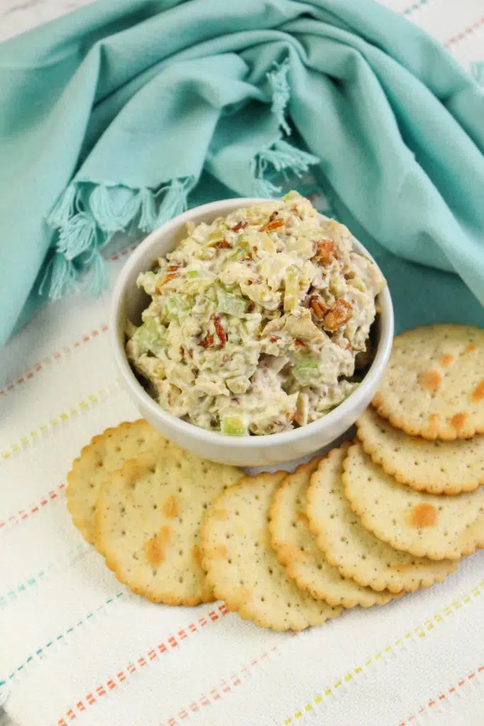 rotisserie chicken salad in a white bowl with crackers