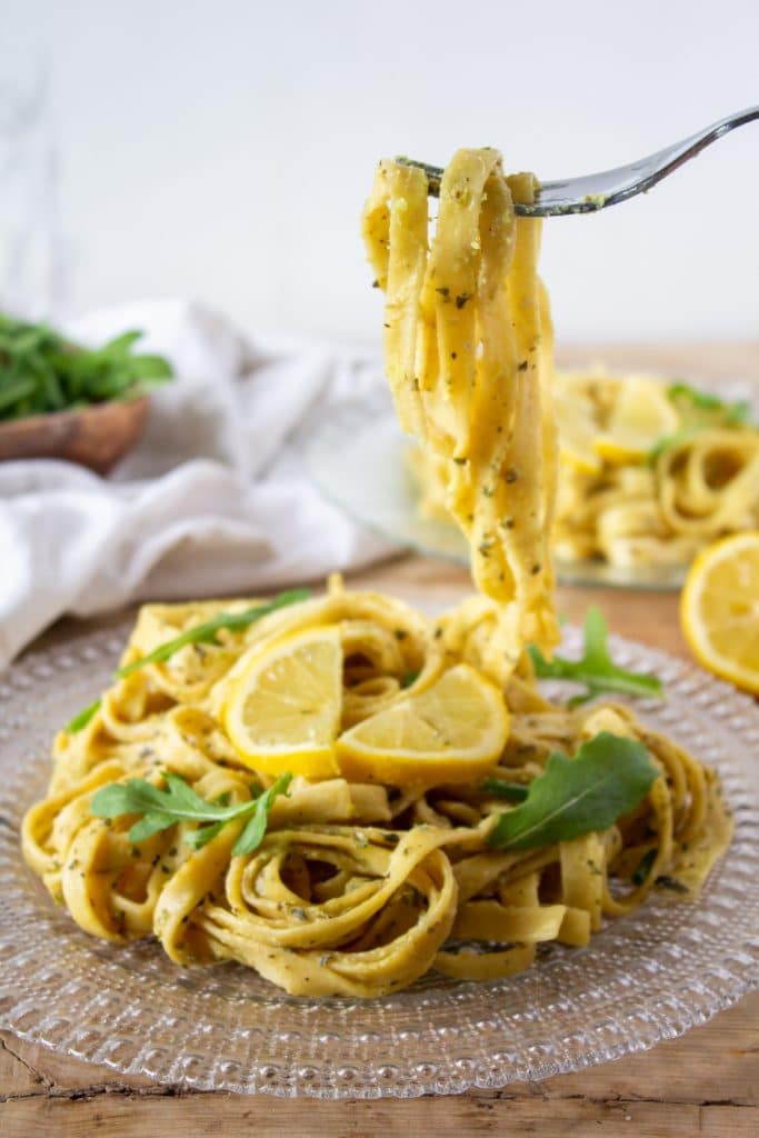 Quick One-Pot Lemon Pasta Recipe 1 one pot lemon pasta on a clear plate with lemon on top