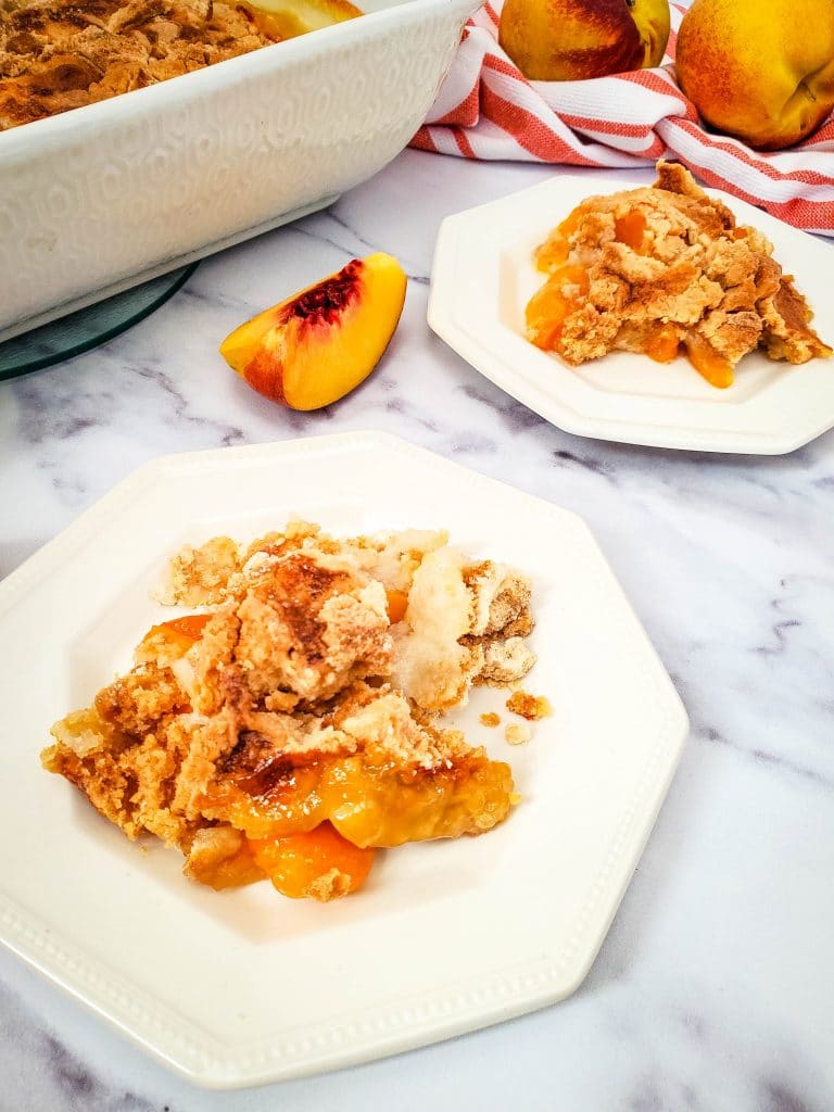 Easy Peach Dump Cake 9 ready to serve peach dump cake on white plates