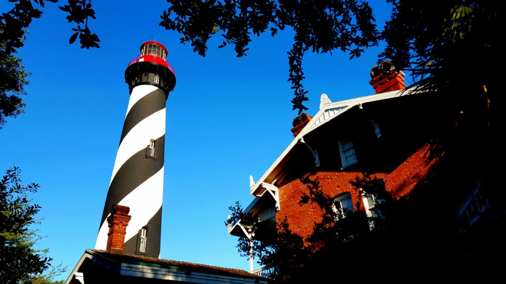 looking up at St. Augustine lighthouse with blue sky