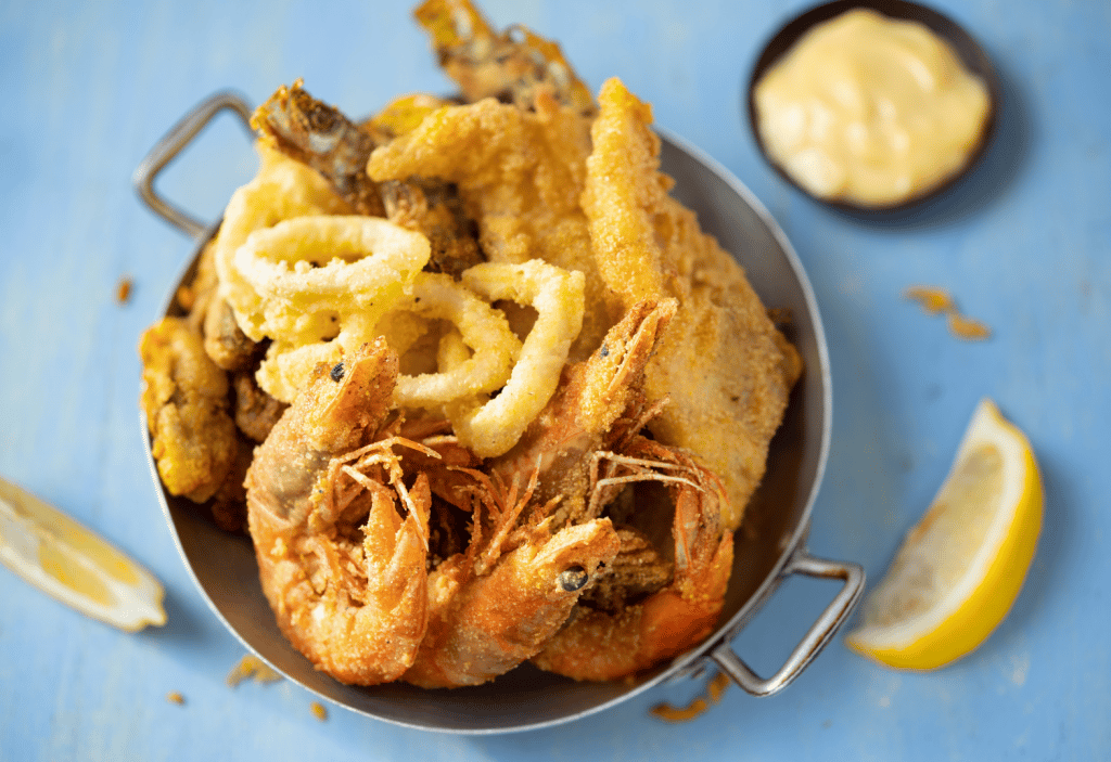 7 Delicious St. Augustine Seafood Restaurants You Must Visit Today 5 overhead view of fried seafood platter with lemon slices in the background
