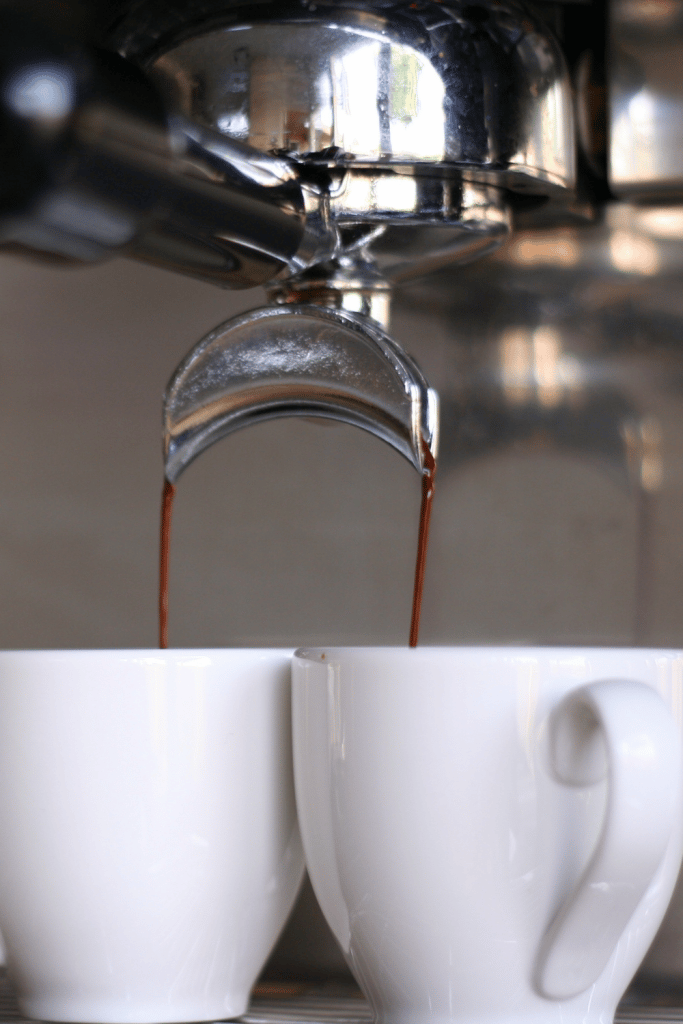 coffee being poured into coffee cups