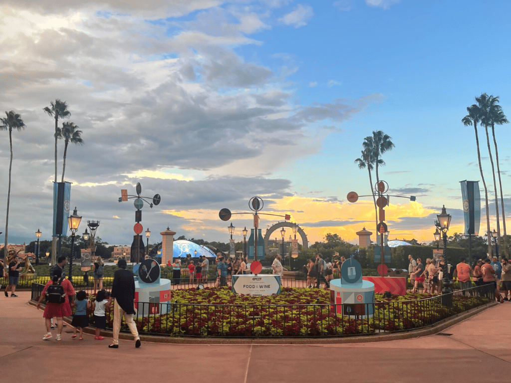 Top 8 Items To Pack For Your Disney Trip 3 Epcot Foot and Wine Festival sign with sunset in the background