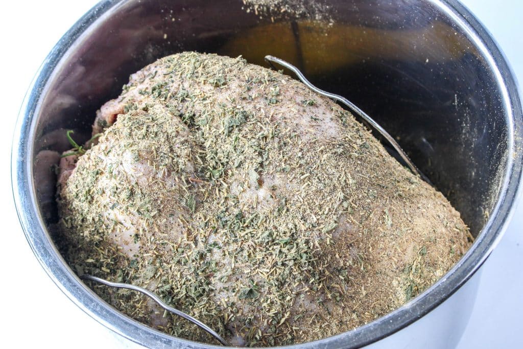 Quick Instant Pot Lemon and Herb Turkey Breast Recipe 13 turkey breast in instant pot with seasonings on top