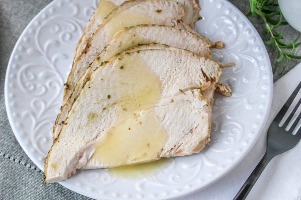 Quick Instant Pot Lemon and Herb Turkey Breast Recipe 4 juicy sliced turkey breast with gravy on top