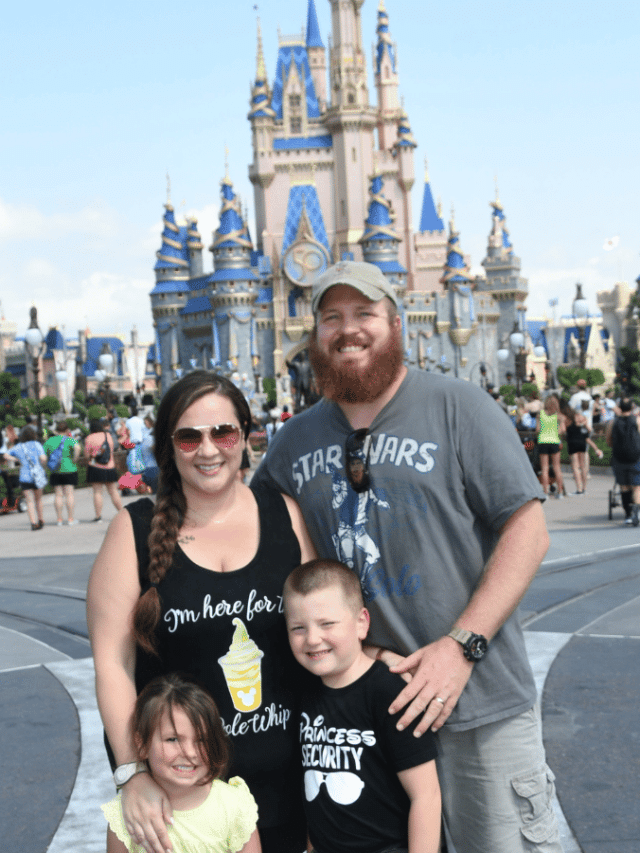 What to Wear to Disney World in October 2 family in front of Magic Kingdom castle