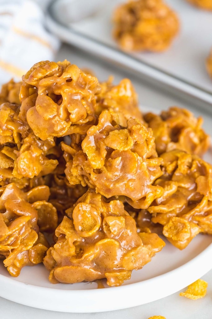 50 Easy Christmas Cookie Recipes with 7 Ingredients or Less 12 close up of cornflake cookies covered in peanut butter