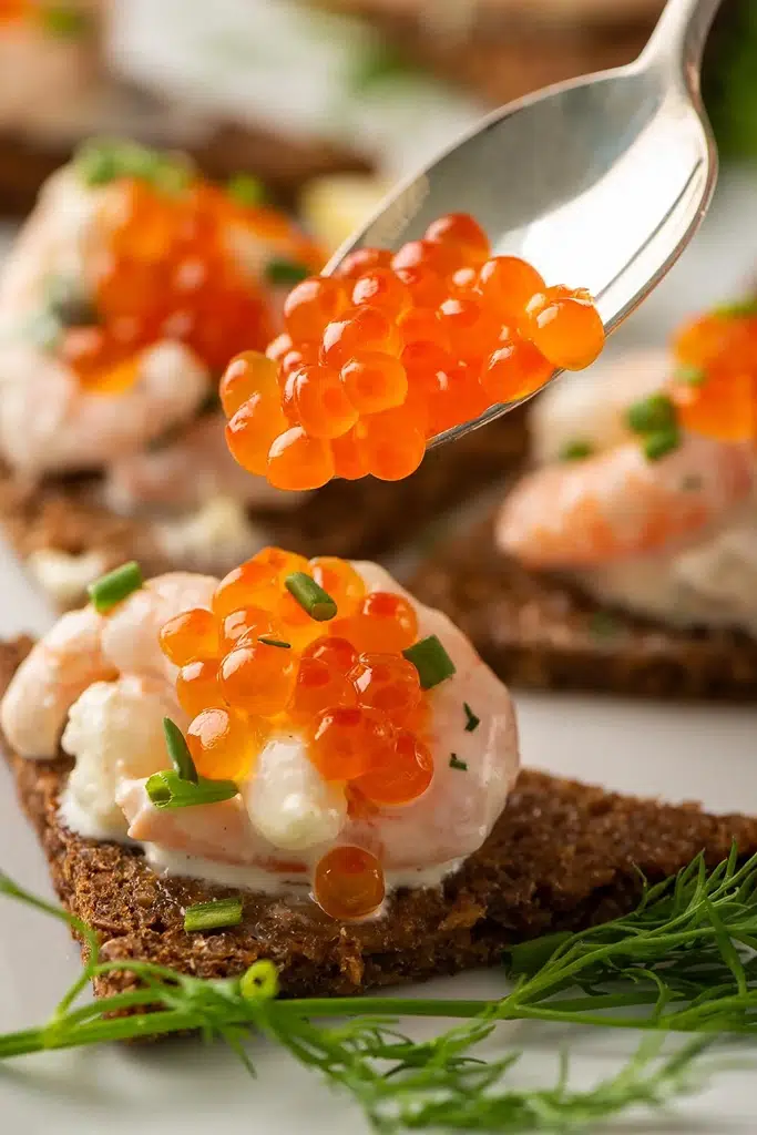 Swedish toast with shrimp sauce and caviar on top 