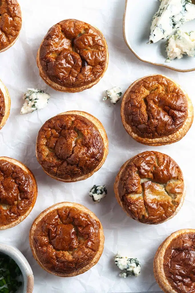 puff pastry tarts with blue cheese crumbles on side 