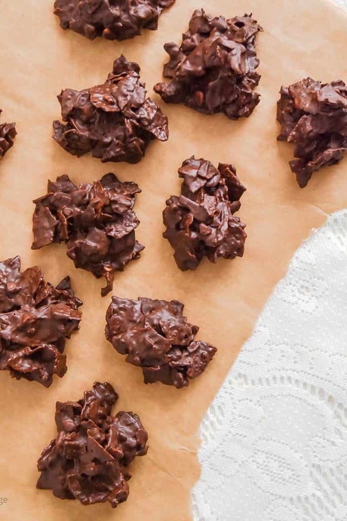 50 Easy Christmas Cookie Recipes with 7 Ingredients or Less 13 chocolate potato chip cookies on brown parchment paper
