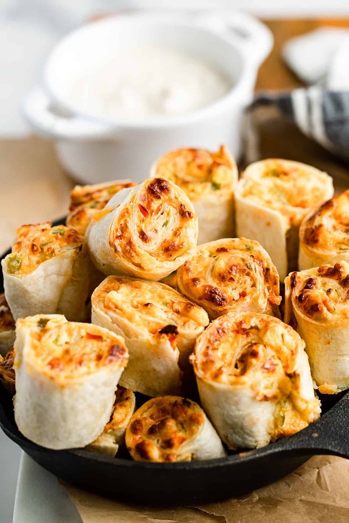 35 Party Appetizers For New Years Eve 23 crunchy pinwheels full of jalapeno cream cheese in cast iron skillet