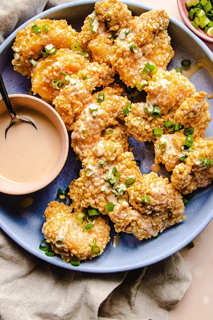 serving tray with panko covered shrimp with bang bang sauce on the side 