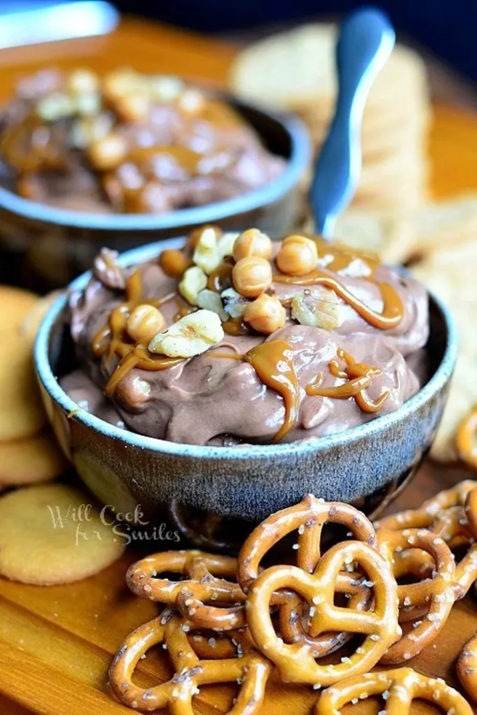 chocolate dip with caramel, pecans and pretzels on side 