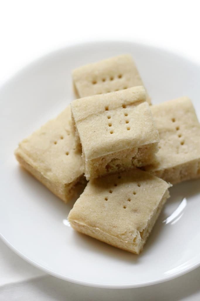 50 Easy Christmas Cookie Recipes with 7 Ingredients or Less 4 vegan shortbread cookies on white tray