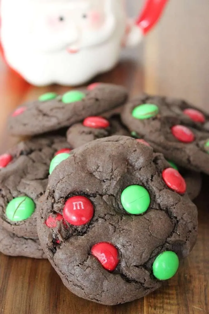 close up of chocolate cookies with red and green Christmas m&ms