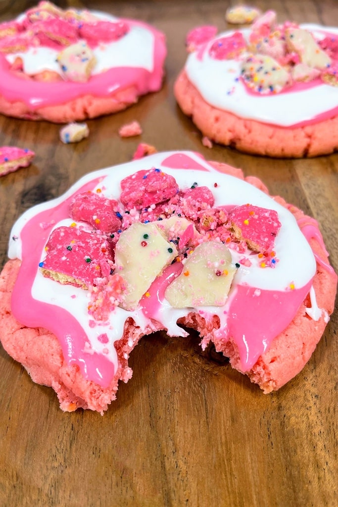pink animal cracker crumbl cookie copycat with crushed frosted animal cracker 