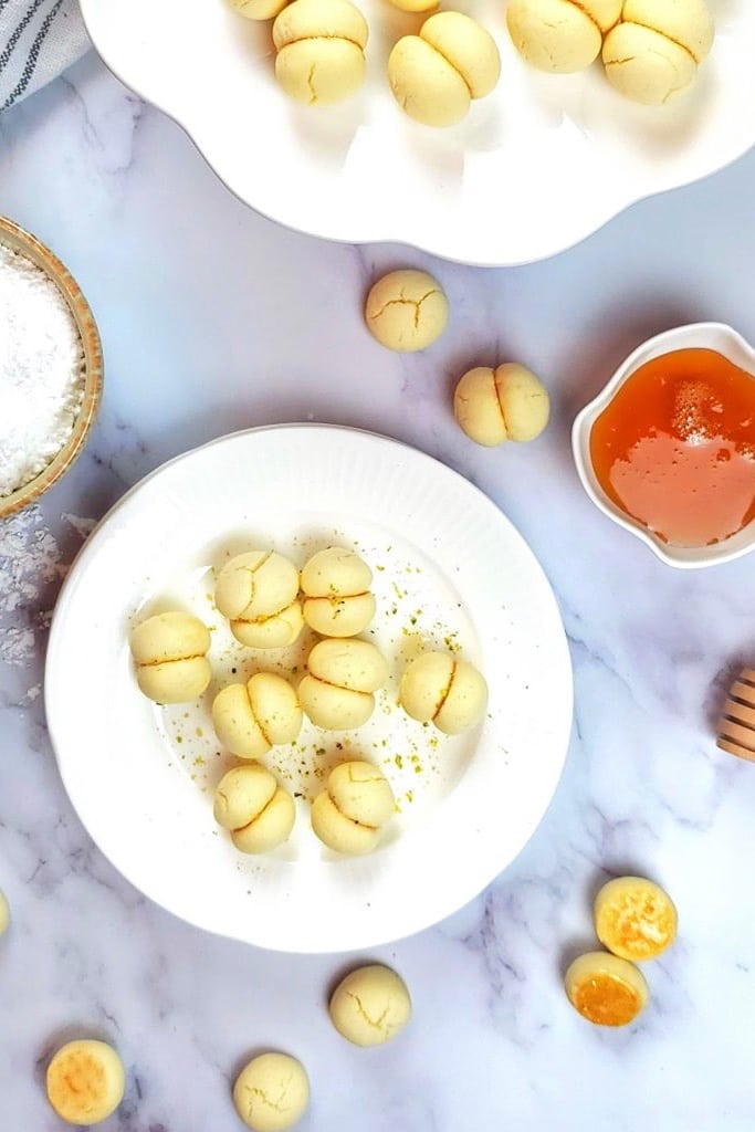 50 Easy Christmas Cookie Recipes with 7 Ingredients or Less 38 melted moment cookies on white plate with sauce on side