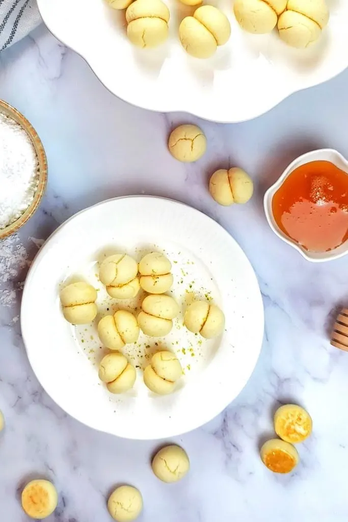 melted moment cookies on white plate with sauce on side 