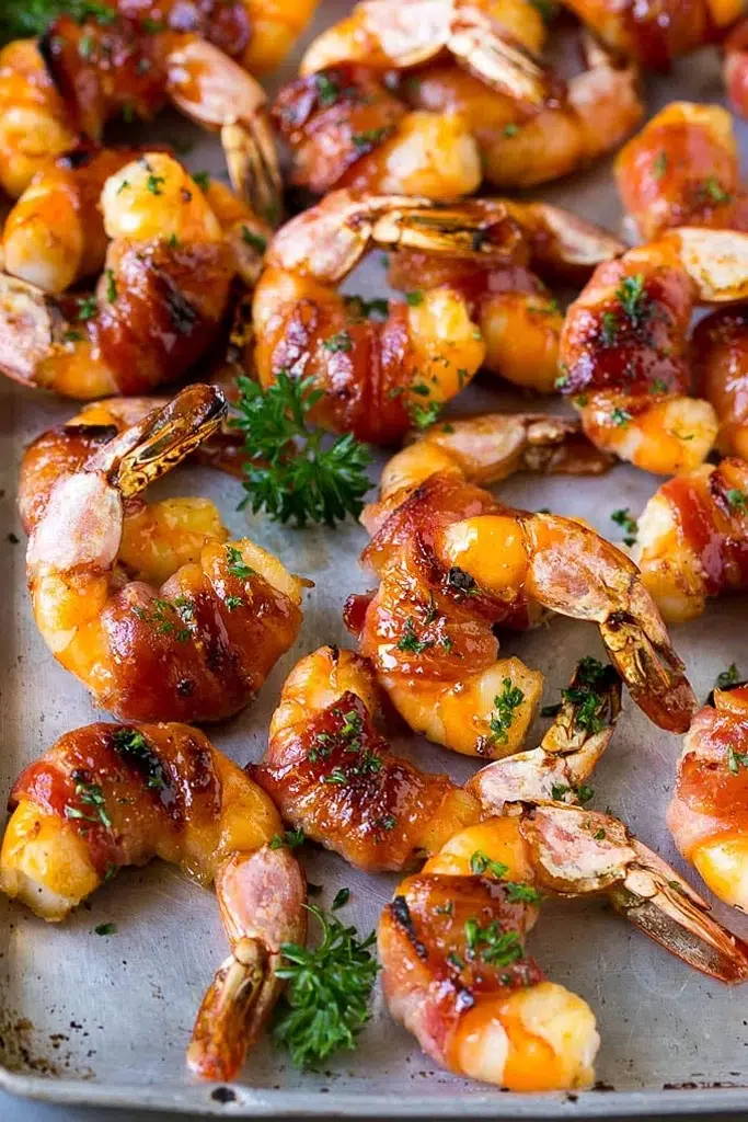 close up of broiled bacon wrapped shrimp