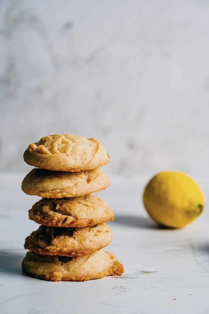 stack of ouzo and lemon biscuits with lemon in background