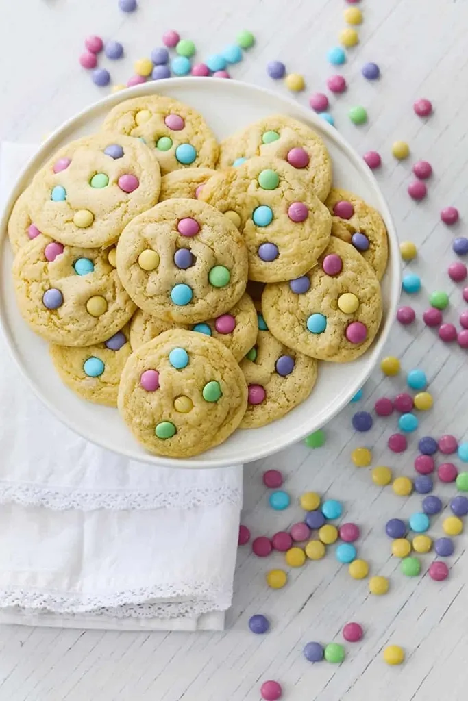 white plate of cake mix cookies with pastel m&ms 