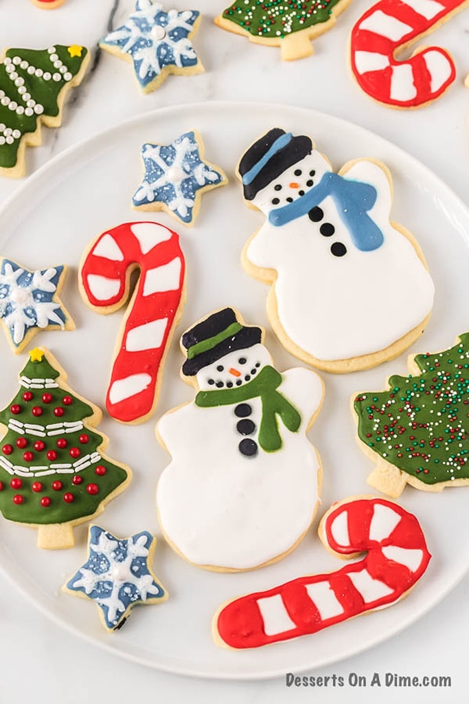 25 Old Fashioned Christmas Sugar Cookie Recipes 6 Christmas cookies on white plate