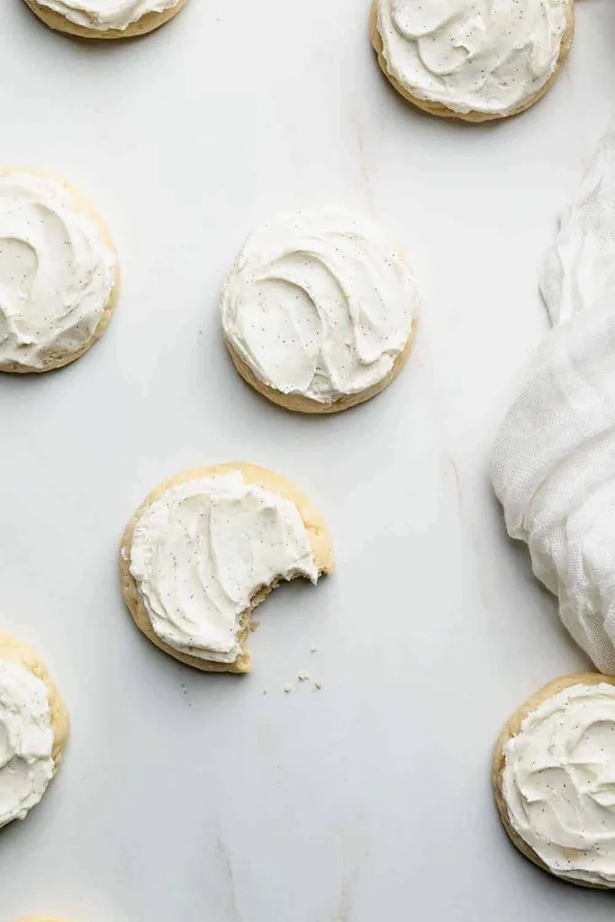 A close up of old fashioned sugar cookies with vanilla icing 