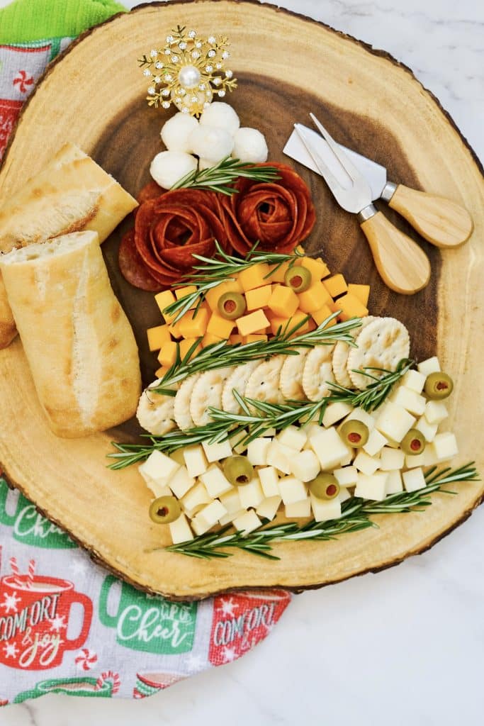 Christmas holiday charcuterie board with ingredients in tree shape