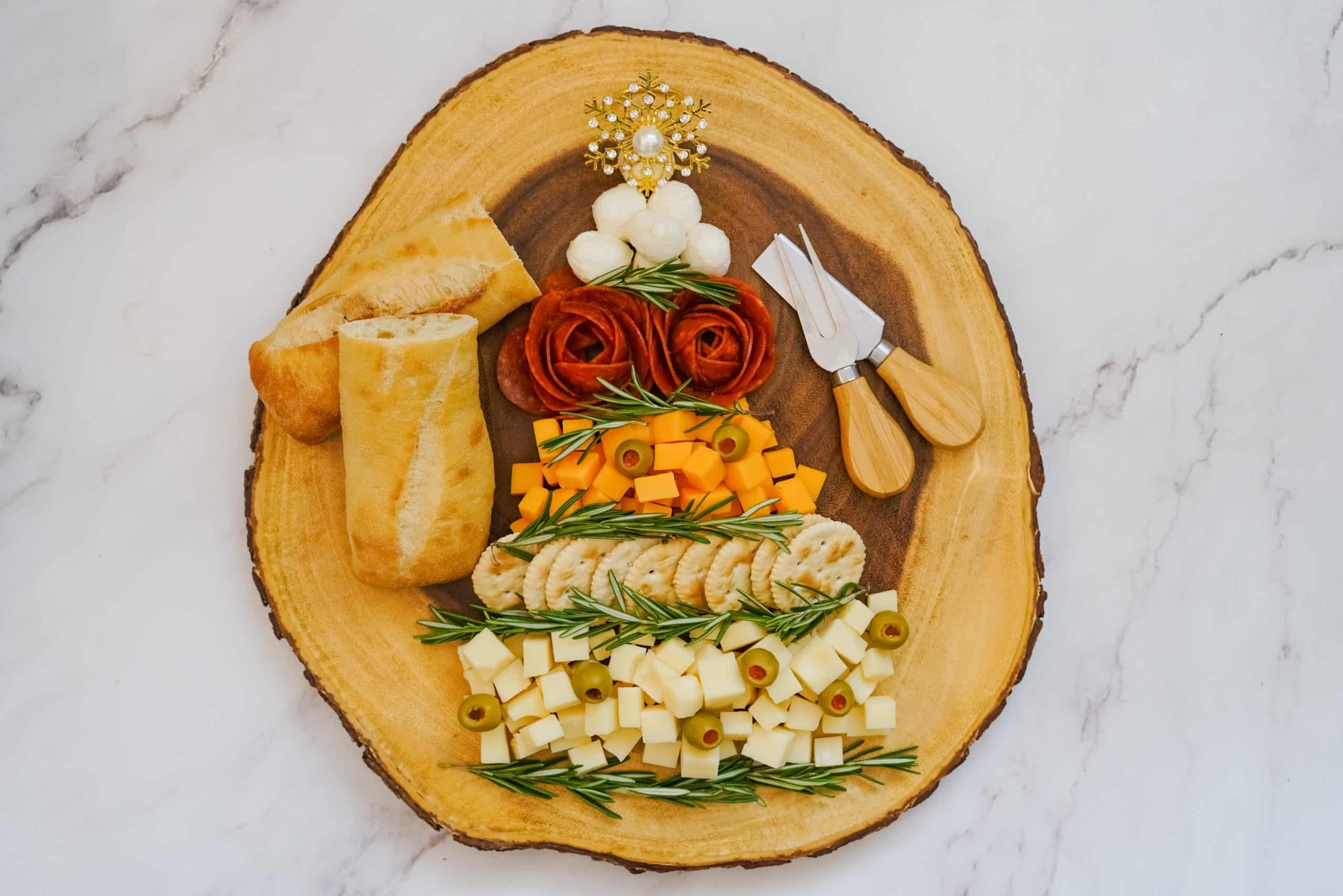 Easy Christmas Tree Charcuterie Board 7 meats and cheeses in shaped as Christmas tree with bread and cheese knife