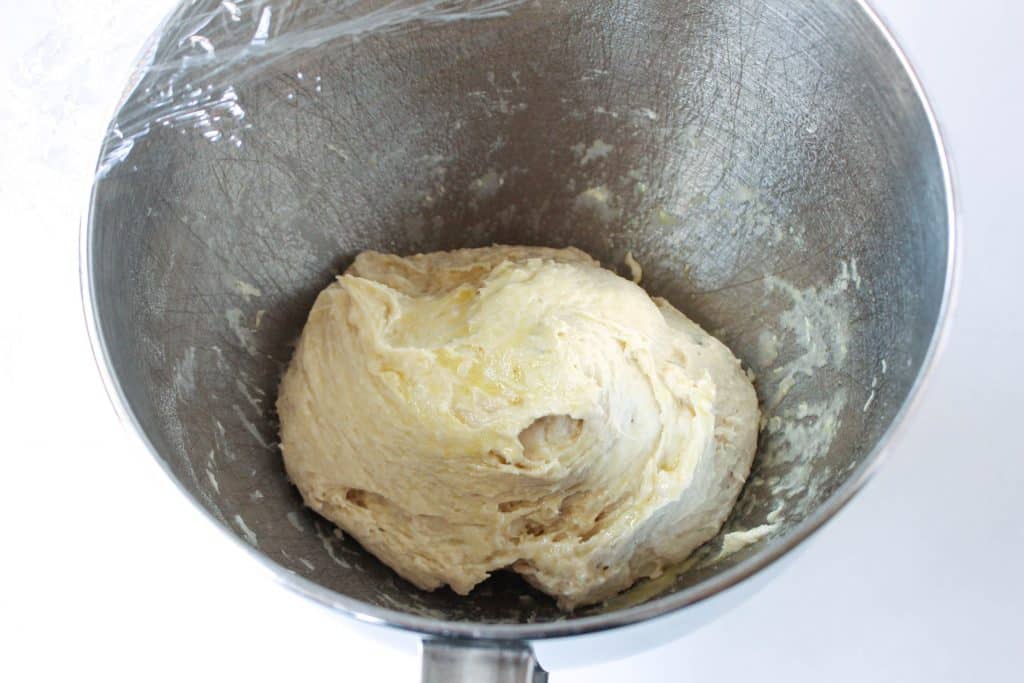 mixed dough in stainless steel mixing bowl