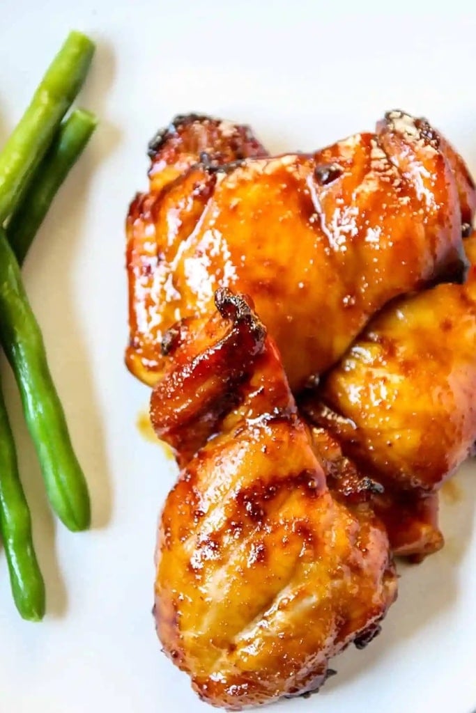 25 Boneless Skinless Chicken Thighs Recipes 18 air fryer chicken thighs with sauce and green beans on side