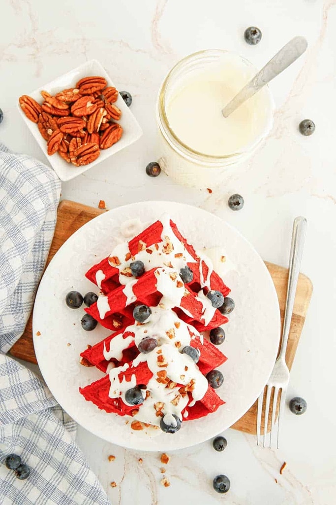 25 Valentine’s Day Breakfast Ideas For Kids 3 red velvet waffles with white chocolate drizzle and blueberries