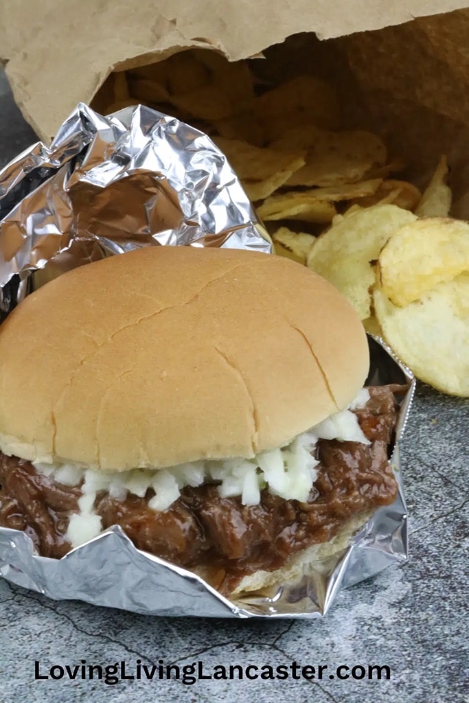 25 Venison Recipes You Will Love 21 deer meat venison BBQ sandwiches with cole slaw and chips on the side