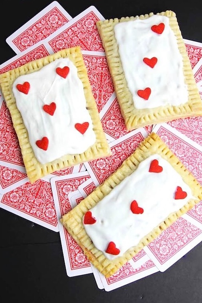 rectangle queen of hearts tarts with red hearts on top of playing cards