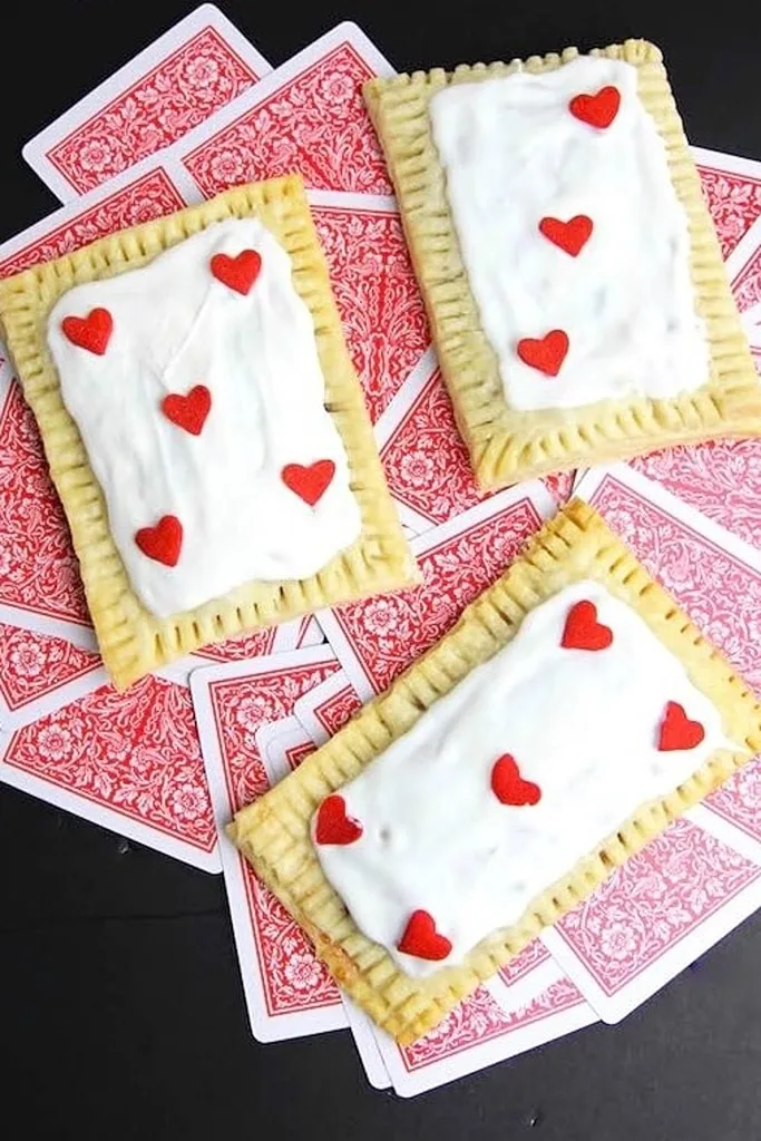 25 Valentine’s Day Breakfast Ideas For Kids 21 rectangle queen of hearts tarts with red hearts on top of playing cards