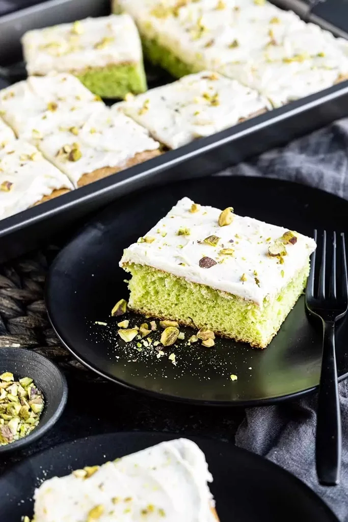 25 Box Cake Mix With Pudding Recipes 24 slice of pistachio cake on black plate with black fork