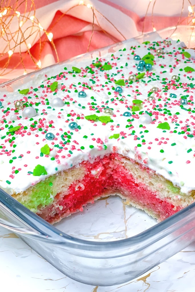 25 Box Cake Mix With Pudding Recipes 26 Christmas colored poke cake with white icing and Christmas sprinkles on top